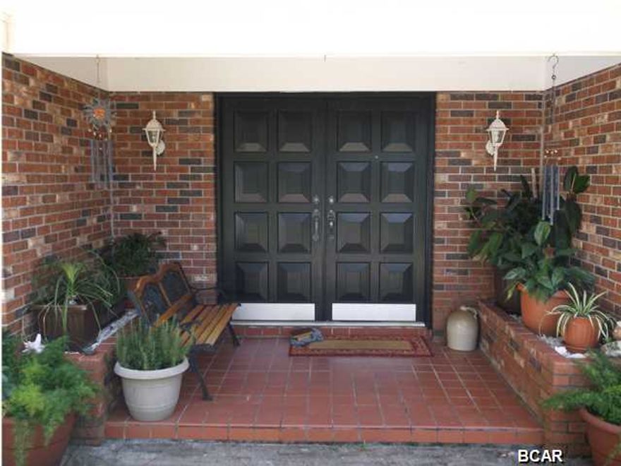 SELLER MOTIVATED BRING ALL OFFERS. Tranquility on the Bayou where you can enjoy the plush open space of 2.12 Acres. Take comfort in knowing that a walk to the dock outback is all that separates you from sailing around the world. Launch your new catamaran from the paved public boat ramp just two houses away. A fifteen minute ride to the new Bay County International Airport is all that separates you from flying around the world. But lets stick with the deep water total Gulf access from your own backyard that is ideal for a large sailboat. The home was originally constructed in 1974 but was effectively rebuilt according to county records in 1985. This 3 bedroom 2 full baths 3000+ square foot REAL BRICK home is very well kept with all the pride of home ownership. Nuzzle by the fireplace