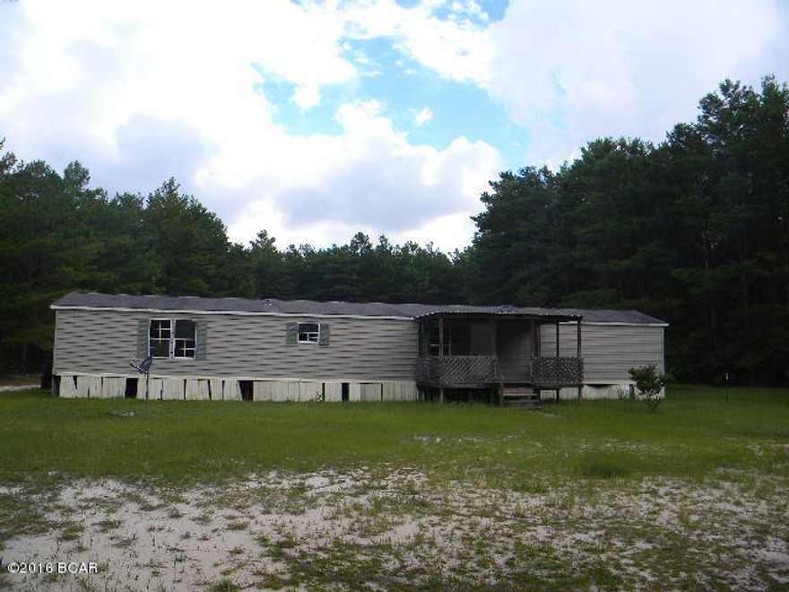 High and dry 3 acres with a 3 br, 2 ba mobile home, covered front and rear porches, couple of good sized sheds, in the Deane Bozeman school area, needs some work so bring you tools and make this your dream home.