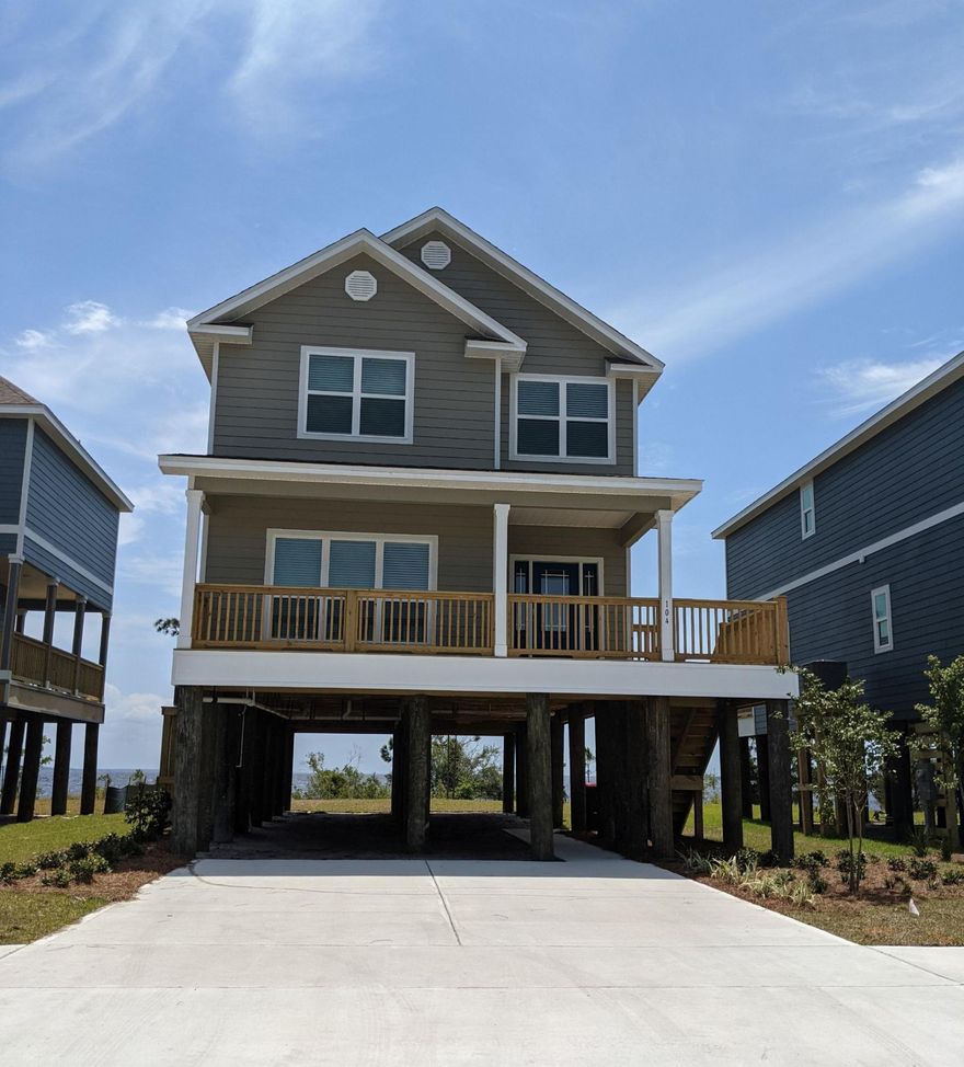 Gorgeous waterfront view! Home is built on pilings. The Bradford is a 2210 Sq Ft, 4-Bed/2.5-Bath floorplan. All bedrooms in this home reside on the 2nd floor. Features of this home include granite countertops, stainless steel appliances, stained cabinetry, LVP Flooring with carpet in bedrooms, elegant 9' ceilings, orange peel textured walls, and beautiful interior doors with brushed nickel hardware.