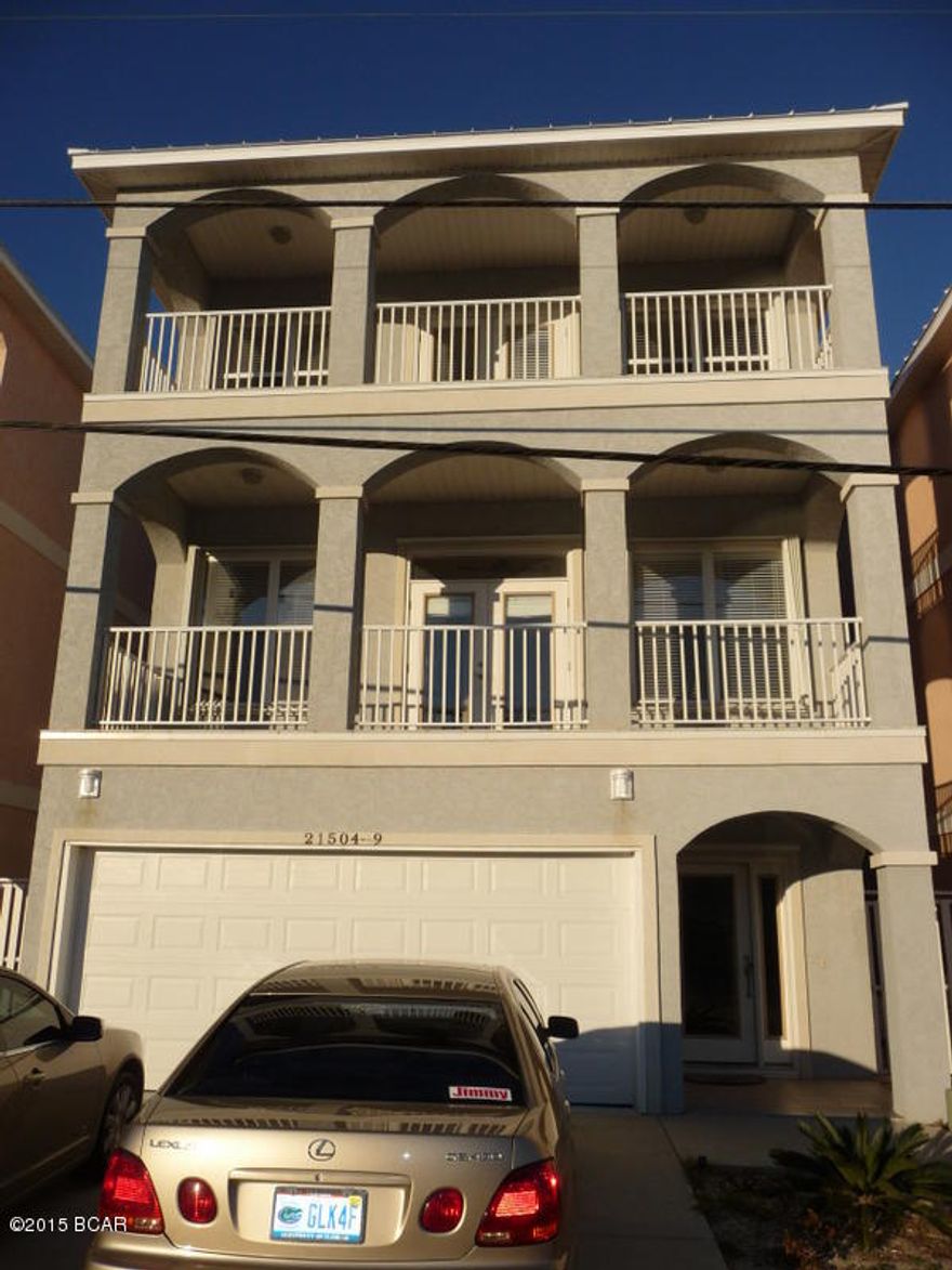 AMAZING GULF VIEWS!  LAKEFRONT LIVING!  3 STORY FAMILY HOME, VACATION HOME, AND/OR INVESTMENT PROPERTY.  GROUND FLOOR HAS DOUBLE GARAGE WITH LOCKOUT APARTMENT - GREAT FOR MOTHER-IN-LAW!  2ND AND 3RD FLOORS HAVE MAIN LIVING SPACES.  FULL SIZE COMMUNITY POOL  LAKE RIVIERA only feet from back deck. DEEDED BEACH ACCESS ACROSS FRONT BEACH ROAD.