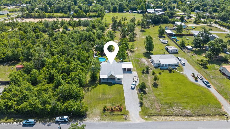 Welcome to your own private slice of country paradise where peaceful living meets modern comfort, all just 10 minutes from town. Situated on 1.34 acres with a beautiful pond backdrop, this property offers the kind of freedom and lifestyle that's getting harder to find. With no HOA, there's plenty of room to enjoy the outdoors, ride side-by-sides, 4-wheelers, and dirt bikes, or simply spread out and enjoy the privacy.

Built to last with a brick exterior and metal roof, this home combines durability, comfort, and timeless appeal. Inside, the thoughtfully designed split-bedroom floor plan features 3 bedrooms on the first floor, creating both comfort and privacy for everyday living.

The kitchen was designed with both style and practicality in mind, featuring beautiful finishes, plenty of workspace, and a gas stove perfect for anyone who loves to cook and entertain.

The spacious primary suite feels like a retreat of its own with a spa-inspired bathroom featuring a deep soaking tub, a large walk-in shower with both a rain shower and regular shower head, and the perfect setup to relax after a long day.

Upstairs, you'll find a large bonus room that could easily function as a 4th bedroom complete with a large walk-in closet or office space. This flexible area would also make the perfect man cave, game room, media room, playroom, or hobby space depending on your needs.

Step outside to a large covered back porch with plenty of room for outdoor furniture and future outdoor kitchen space, all overlooking the backyard oasis. The newer pool and pool deck are designed for easy maintenance so you can spend more time enjoying and less time working. Between the pool, pond, and open space, the backyard delivers the ultimate country lifestyle that will make you never want to leave home.

Additional features include custom mudroom cabinetry for extra storage and organization, plus a laundry room straight out of TikTok, stylish, functional, and designed to make everyday tasks feel a little more enjoyable.

If you've been searching for a property that offers space, freedom, and a lifestyle you can truly enjoy, this one checks all the boxes.