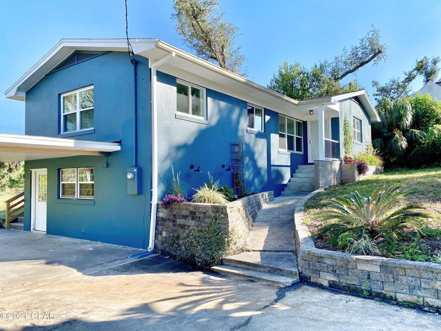 CURRENTLY UNDER CONTRACT, SELLER ACCEPTING BACKUP OFFERS  Just across the street from beautiful Massalina Bayou and a very short stroll to Historic Downtown, with all of its restaurants, shopping, and activities. Walk down to the McKenzie Park Farmer's Market every weekend-- you'll love it! The main level of this recently renovated home boasts an open floorplan, glossy plank flooring, tons of windows & natural light, and 3 bedrooms w/ 2 full baths (check out the ShowerTower in the Mbath) . Downstairs is a small  apartment w/ a half bath, perfect for an office or play room w/ a private entrance off the carport. New roof in 2019, updated stainless appliances, granite countertops, new windows & doors, and a massive deck across the back of the house overlooking a small creek through the back y