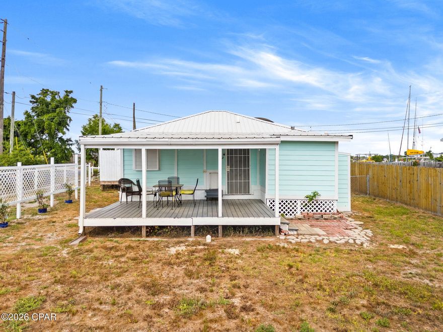 Welcome to coastal charm and opportunity at 100 N Church Ave in Panama City! This freshly painted and absolutely adorable Florida cottage sits on a desirable corner lot just steps from the water, offering the perfect blend of lifestyle and investment potential. Built in 1950 and thoughtfully maintained, this 2-bedroom, 1.5-bath home features 926 square feet of inviting living space with timeless character and durable construction.
As you arrive, you're greeted by an open front porch that faces the water--an ideal spot to enjoy morning coffee while overlooking the nearby marina. Boating enthusiasts will love being just 0.1 miles from a public boat ramp, making it incredibly easy to get out on the water at a moment's notice. This location places you right in the heart of a thriving boating community.
Inside, the home offers a functional layout with cozy living spaces and plenty of natural light. The kitchen is equipped with a gas stove, and the home also features a gas tankless water heater for added efficiency and on-demand hot water. Step out back to a large covered porch overlooking the fully fenced backyard--perfect for entertaining, relaxing, or storing your outdoor gear. The property also includes a detached one-car garage, ideal for boat storage, a workshop, or additional storage space.
This home is built with longevity in mind, featuring pier and beam construction, durable Hardie board siding, a metal roof, and Carolina shutters throughout--providing both charm and added protection. City water and sewer services add to the convenience.
Whether you're looking for a primary residence, a second home, or an income-producing property, this one checks the boxes. With its prime location and proximity to the water, this home offers excellent short-term rental potential (buyer to verify local regulations).
Conveniently located approximately 6 miles to Tyndall Air Force Base, 10 miles to downtown Panama City, 18 miles to Panama City Beach and Pier Park, and about 20 miles to Northwest Florida Beaches International Airport (ECP), you're never far from work, travel, dining, and entertainment.
Don't miss your chance to own a piece of Old Florida charm with modern-day possibilities!