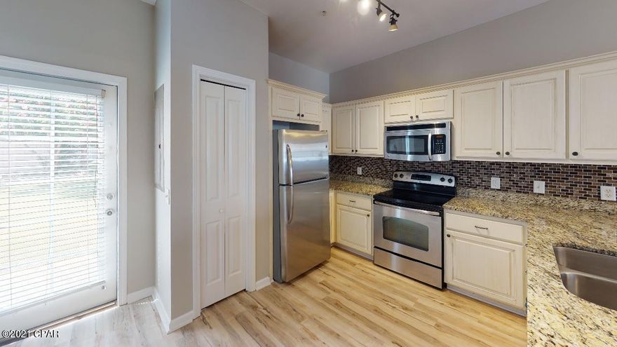 Contract Pending - Accepting back up offers.   Annabella's Townhomes! Affordable luxury located within a short distance to the world's most beautiful beaches, Pier Park, Hathaway Bridge, as well enjoy the on-site amenities such as the community pool, fitness room, dog walking areas, ponds and fountains. This is your chance to own a beautiful 2 bedroom 2.5 bath townhome in the Panama City Beach area.  

The open floor plan features stainless steel appliances and granite countertops in the kitchen.  There is also a separate pantry for extra storage.  The spacious Master bedroom includes two separate closets and there is a double vanity in the master bath with a garden tub and separate shower. Second bedroom has a large walk-in closet, and attached bathroom with shower/tub comb This home has been completely painted throughout and owner has installed new luxury vinyl plank flooring throughout the first floor and new plush carpet on stairs and second floor.