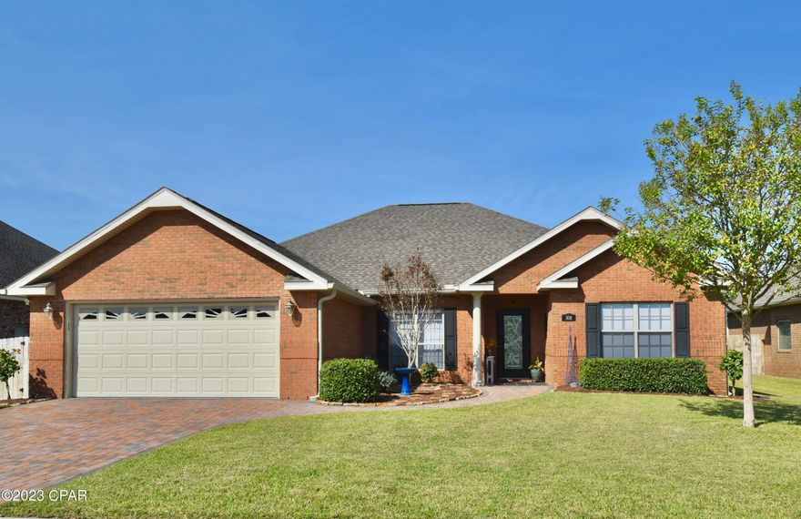 Welcome to the desirable community of The Meadows with an executive style 18 hole public golf course accessible from the back of the neighborhood. This beautiful custom all brick home offers you plenty of space with over 2300 sqft. As you enter the foyer you notice one of many custom features, a beautifully designed wood floor inlay, as well as a wall nook with accent lighting for decorations. The open concept of this home with a generous sized entertainment space extends to the kitchen and living room area. The spacious living room, highlighted by an 11' tall tray ceiling and an electric fireplace with mantel, is open to dining and kitchen. The formal dining room at the front of the home features an eye-catching tray/coffer ceiling and two columns. The kitchen has an abundance of custom cabinets, a breakfast bar, stainless steel Frigidaire Professional Series appliances, granite countertops, custom stone back splash, recessed lighting, pullout cabinet storage, wine storage, a pantry with heavy duty wood shelving, and much more! This kitchen is surely any Chefs dream! The master bedroom is located on the back of the home and features a 10' tray ceiling, a built-in desk nook, en-suite bathroom and offers the convenience of a door leading to the screened-in back porch The Master bathroom includes double vanities, jetted bathtub with two nooks above it, step-in tiled shower with bench, a separate water closet, and his and hers walk-in closets. Enjoy the privacy of a split floor plan between the owner's suite and the additional bedrooms. Another wall nook with lighting catches your eye in the hallway between another full bathroom with shower/tub combo and wainscoting and three additional bedrooms, which all have holiday/extra storage built in above the closets. Crown molding throughout and new window treatments, Levolor Cellular shades, room darkening in all bedrooms, all others are light filtering. The laundry room with sink is next to the large attached two car garage with newly painted floors and walls, drop down stairs for storage, side door, and attic storage above. This home offers gutters and a paver walkway and driveway, large enough for four cars. Last, but not least, relax, grill, or watch the kids or your pets play in your large fenced backyard from your screened-in covered porch or the pergola on the 20' x 20' concrete back patio. All measurements are approximate, verify if important.

Exterior Features:
Irrigation system using reclaimed water on separate meter
Hurricane protection: pre-cut plywood
Community playground nearby

NOTE: Public Golf course is not part of the HOA.