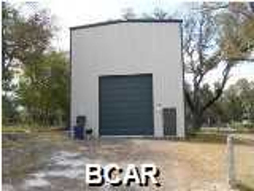 The zoning on this property was recently changed from light industrial to Mixed Use-2 which includes residential, retail, office. Click on the picture to see more information on this zoning. With 30' clear heights inside the building one could build an upstairs living quarters and still have lots of room on the ground floor for boat and RV storage. This 30' x 60', 1800 sq. ft. metal building was built in 2013 and has ceiling clear heights of 30'. It has 2 16' high by 14' wide roll-up doors one on either end of the building. The property is located across the street from the Church St. public boat ramp.  Security cameras and system do not convey with the property.
