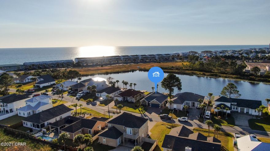 CURRENTLY UNDER CONTRACT, SELLER ACCEPTING BACKUP OFFERS

Captivating Coastal Charmer. How incredible would it be to live so close to the beach & have a lake in your backyard! With just a short 2 minute walk to beach access this property is a rare gem! From your private dock you can actually see a peek a boo view of the ocean waves. The seller is an interior designer, and it is quite evident as you walk through the door. From the custom kitchen which features an amazing a large walnut bar, to the beautiful fireplace this home is a one of a kind. A large screened in porch leads out to the landscaped yard, outdoor shower and your own private dock. This is the perfect sunset spot to end an incredible day at the beach.