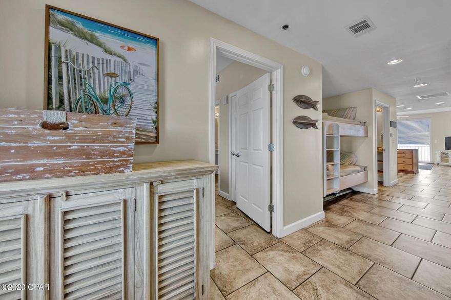 Welcome to Splash 1003E!  Known as one of the best short term rental producers in PCB, Splash Resort is an amenity rich complex on the west end of Panama City Beach, and less than a 10 minute drive to the beaches of 30A.  While accommodating for all ages, Splash is THE destination for families with children.  The kids have everything you desire, from a water park and lazy river to an arcade room and much much more.  This beautiful one bedroom/2 baths with bunks in the hall is on a premium mid floor and comes rental ready and configured to sleep 6!  Covered in high end tile floors, professional chosen beach themed décor, this condo is being sold fully furnished and equipped.  The owners had several reservations for friends and family, yet still achieved roughly 24k in income for 2019!