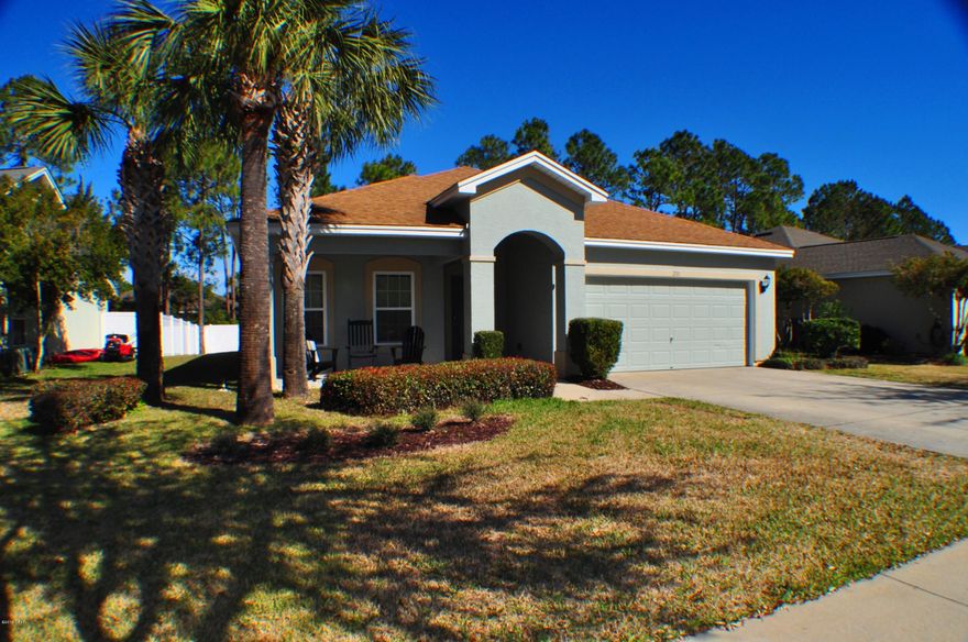 CURRENTLY UNDER CONTRACT, SELLER ACCEPTING BACKUP OFFERS.BRAND NEW CARPET & PAINT! Lovely Palmetto Trace home with 3 bedrooms, 2 baths & approx 1,768 sq ft of living space. Home features a split-bedroom floor plan & interior amenities include granite counters a pantry in the kitchen, a tray ceiling in the formal D/R, & the  Master Bedroom has a huge walk-in closet with an adjoining bath w/double vanities, a garden tub & a separate shower. There is a covered back patio overlooking the roomy back yard, an automatic sprinkler system & a two car garage.  This home is just a few houses away from one of two community pools within Palmetto Trace.  You're also just around the corner from Pier Park & Frank Brown Recreational Complex.  All info is approx. & must be verified by Buyers if important.