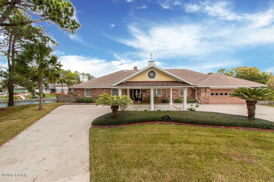 Ready to move into your dream home? Here is your chance!! With more than 200 ft. of canal frontage on a ½ acre, peninsula like property, this 3,700sq.ft. home has amazing views everywhere you turn! Not only are you located in Bay Point, one of the most sought after neighborhoods in Bay County, your new dream home sits on a quiet cul-de-sac surrounded by beautiful homes. With real hardwood floors, new paint, a stunning kitchen, an awesome florida room, and beautiful detail throughout; this home is a looker from the inside just as much as the outside. When you’re ready to bring the party outside don’t worry, the ½ acre lot, wonderful pool, and the grilling area are just what you need. Oh yeah….. and a dock that will accommodate a boat up to 50ft. Other great perks are an AC that is only 4 years old and a 50 year shingle on the roof. A home like this is rare, so don't miss your opportunity. Call today to view this magnificent home!