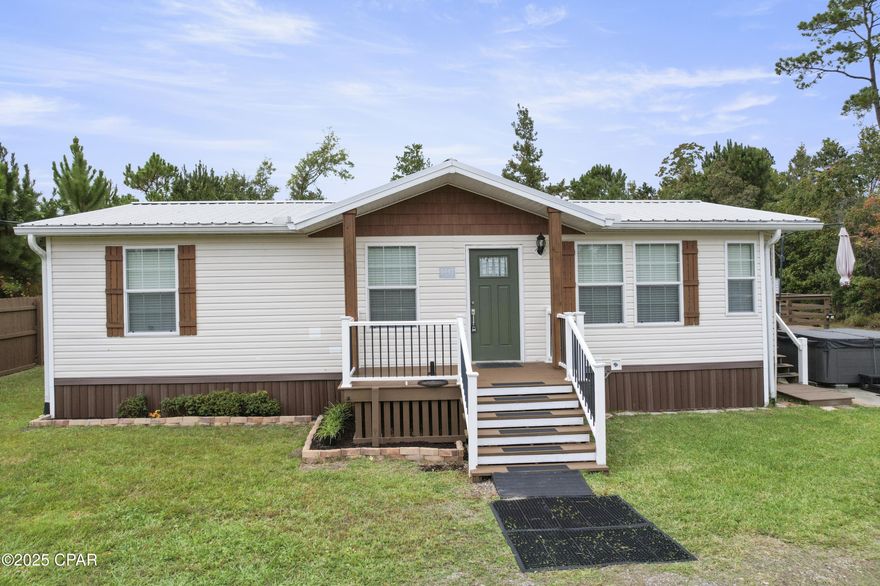 TURN-KEY, AFFORDABLE, PRIVATE, QUIET LIVING, just minutes to the new Publix shopping center on Hwy 231! Improvements over the last 2 yrs include: new appliances, new flooring, well pump, water filtration system, renovated Master Bath with a 7' tall shower, new skirting around the home, a new french drain installed for water runoff, a new privacy fence and a new 12x18 shed with power and lights. Spacious living room opens through an arched entry to the kitchen. Dining area is surrounded by natural light. Beautiful granite counters and an island with a breakfast bar make this a great space for meal prep. Master suite is large enough to comfortably hold a king sized bed, plus has a walk-in closet. The 2nd and 3rd bedrooms are conveniently next to the hall bath. Off the kitchen is a lovely new side deck where you can enjoy a cup of coffee in the morning...or use it as a sundeck when you are enjoying the hot tub, (that conveys with the property). There is a shed, perfect for your yard tools. The newer shed with lights, electricity and separate breaker box, will make a great workshop or she-shed! Don't miss this opportunity to down-size or start your home ownership in a turn-key, very affordable home!  Buyer to verify all information, including but not limited to measurements, square footage, room size, lot size, features, and property details, prior to closing.