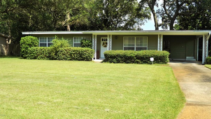 Gorgeous! Well cared for home with 3 spacious bedrooms and 2 bathrooms, in Woodlawn subdivision. Convenient to Panama City Beaches as well as dining, schools, and shopping. This home truly shows pride in ownership. New exterior paint on Redwood siding in 2012 and flooring updated in 2006. Sprinkler system on well and yard has been well cared for, evident in the curb appeal. Kitchen includes a breakfast bar and lots of cabinet and counter space. A formal living area adds an elegant touch to this spacious home. Open concept dining and den overlook a large fenced in back yard. Fenced in back yard features lots of space for pets and children. Don't miss this opportunity to buy!