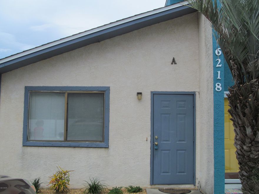 Very Nice 1 bedroom 1 bath duplex walking distance to the beach- all tile flooring- updated-new Kitchen- ceiling fans and blinds.Fenced back yard- Septic tank- washer & dryer hook ups for full size appliances