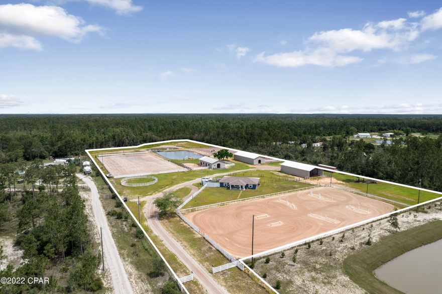 Don't miss your chance to own a private equestrian ranch in Panama City. This craftsman style home offers a 3/2 split floor -plan with 9 ft ceilings and updates throughout; a new roof, new HVAC and new windows in 2019 and beautiful blonde floors in September 2018. This 10 acre, equestrian property comes with nothing shy of all you need to make your horse's dreams come true ; 2 arenas (150x300) & (130x200), a round pen, a large pond and 3 enclosed barns with a combined 16 private stalls. Barn 1 consists of 6 (12x12) stalls with 5 individual tack rooms with private horse runs/paddock and has a half bath for added convenience. Barn 2 provides 7 (12x12) stalls with tack and feed rooms, and Barn 3 has 3 (12x12) stalls with plenty of room to add as well as RV storage w/ septic hookup.