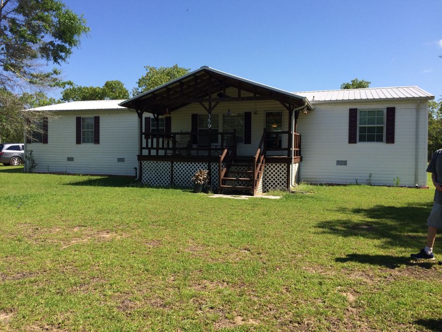 Beautifully maintained and improved doublewide Fleetwood with 1,792 square feet under air.  New roof and A/C unit resulting in very low utility bills.  Home has both a family room and living room.  Living and dining areas are open to the spacious kitchen with newer appliances. Master bedroom suite is remarkable.  Loads of room.  Newer heavy duty covered front porch along with a covered, screened lanai in the back. Separate 2 car covered carport and work shop plus storage room attached to the back of the carport.  Just a minute or two from Silver Lake.  Half way between Marianna and Panama City.  Land is well landscaped.  Well worth the trip to see this beauty!