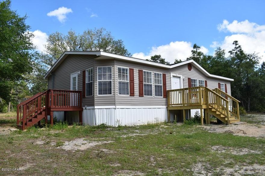 Lovely Lakeview!  Beautifully renovated Manufactured Home across from River Pond.  Nice view of lake.  Recent renovations include new light fixtures, new stove & dishwasher, all new painted ceilings, walls, doors & trim, new smoke detectors.  Brand New carpet in Living Room, new tiled floors in Master bedroom & 2nd bedroom.  Master bedroom has large walk-in closet, MBath has deep tub, separate shower & double vanities.  Sheet plank-style vinyl floor in 3rd bedroom.  Big kitchen with lots of cabinets & center island.  Inside laundry room with hookups & cabinets.  All electric home.  Newer HVAC system. No hurricane damage.  Very large lot has huge back yard area. Private dead-end road  with only a few neighbors. Peaceful & quiet location.  New front deck. No pets preferred. Broker/Owners.