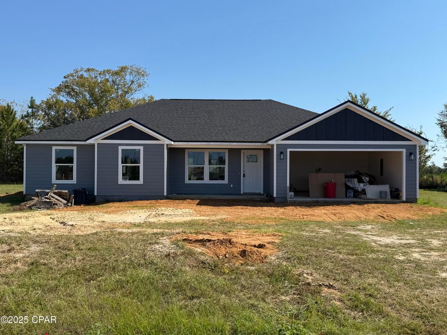 Welcome to brand new construction in the beautiful Arboles Subdivision, conveniently located just minutes from Altha, Fl. This thoughtfully designed four bedroom, two bath home offers a split floor plan and open concept living that is perfect for both everyday comfort and entertaining. Built with quality and efficiency in mind, the home features a 25-year architectural style shingle roof, durable fiber cement siding, R-38 attic insulation to help keep utility costs low, and an attached two-car garage. Inside, you'll find upgraded finishes throughout, including soft-close hardwood cabinetry, granite countertops, brand new appliances, extensive decorative molding, upgraded engineered wood flooring, and a stylish lighting package that enhances every space. The spacious master suite is a true retreat, highlighted by a tray ceiling with ambient up-lighting, a walk-in closet, and a luxurious master bath featuring a tiled walk-in shower with glass doors and a double vanity. Outdoors, the home is completed a covered back patio, perfect for relaxing or entertaining, along with a full landscaping package that adds to its curb appeal. Photos shown are examples from a completed model home. This home is currently under construction with an estimated completion date of January 2026, offering a wonderful opportunity to own a brand new home in a desirable neighborhood.