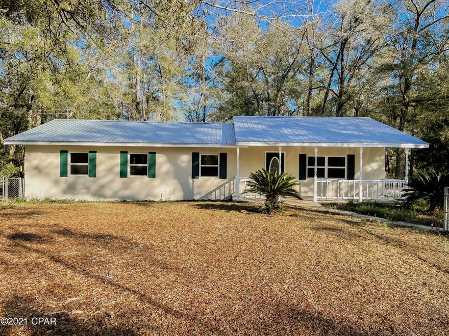 Check out this adorable 4 bedroom, 2 bath newly renovated home on a 1 acre waterfront lot. This home features a new metal roof, new windows, new flooring, new interior and exterior paint, updated kitchen with new cabinet hardware, subway tile backsplash, and refinished cabinets. The Master Bedroom is very spacious and has 2 closets. Both bathrooms feature tub/shower combos, and lots of cabinet space. The large front yard is fenced in with a basketball court and tire swings. Spend your days relaxing on the adorable covered front porch, enjoying nature.

The backyard has endless possibilities and overlooks a small lake. Only 4.5 Miles to the Choctawhatchee River launch.
