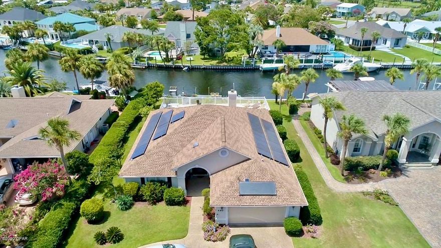 ***UNDER CONTRACT SELLER ACCEPTING BACKUP OFFERS.***CANAL FRONT HOME WITH DEEPWATER GULF ACCESS!! This fantastic Florida home with gorgeous canal views features all the amenities for great entertaining like a gorgeous heated inground pool, jet ski lift and dock.  Bring your large fishing boat.  The outdoor pool area hosts a beautiful and spacious deck along with a half bath and outdoor shower.  This home is energy efficient with its Solar system so your electric bills will save you plenty of $$.  The interior of the home features an open floor plan, with a cozy gas fireplace and a spacious kitchen with granite counter tops and a large breakfast bar. The master suite is spacious with a sitting area, two walk-in closets and an ensuite bathroom with double vanities and large shower. Roof was installed in 2016.  New air conditioner in 2018.  New ice maker 2018, garbage disposal 2018 and new solar panel controller in 2020.