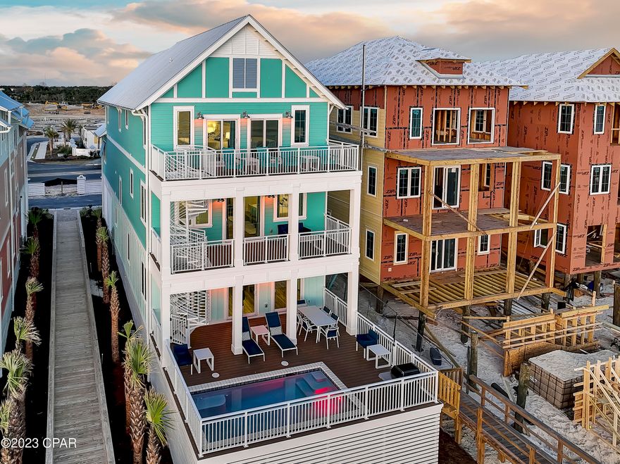 Margaritaville Beach Cottage Resort is the newest and hottest development in Panama City Beach.  Located along the sugar white sands of Panama City Beach, Margaritaville Beach Cottage Resort is a state of mind where you'll find a slower lifestyle, relaxed sunsets, easy access to food and drinks, and a once-in-a-life-time lifestyle experience where the views are spectacular, and the amenities are like no other.  Along the Gulf Of Mexico, you'll find this majestic 6 Bedroom plus bunks, six-and-a-half bath home with a private pool, spacious entertainment and living areas, direct beach access, and parking for five cars. Stainless Steel appliances, Quartz countertops, tankless water heater, and elevator to all three floors makes this perfect a home for large family gatherings and entertaining groups of friends to watch sunsets and lounge by the private pool.  This home is being sold fully furnished and ready for immediate rental occupancy.  The amenities you will experience and enjoy at Margaritaville Beach Cottage Resort include 580' of dedicated beachfront, an expansive resort oasis pool, 425' lazy river, an on-site restaurant and poolside bar, poolside cabanas, waterslides, and water features, pickleball court, game lawn, fire pit, souvenir, and sundries shop, outdoor movie showings, hammock grove, beach chairs and umbrellas and much more.  Amenities are currently under construction.