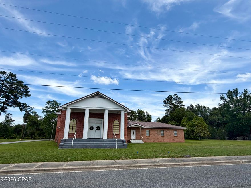 Approximately 184 feet of frontage on Highway 231 in Cottondale, Florida! Situated on a corner lot along a four-lane highway with a turn lane, this property offers outstanding visibility with a daily traffic count of approximately 9,100 vehicles. The brick church building, constructed in 1975, features approximately 5,525 square feet and includes a large sanctuary, spacious fellowship hall, kitchen with ample cabinetry, sink and residential stove, office and classroom downstairs, plus four additional classrooms upstairs. There are three single restrooms downstairs and one upstairs restroom with a tub/shower combination. Please note: some cloth wiring is present (see photos).

Additional improvements include two storage buildings and an older single-wide mobile home on the property. With excellent highway exposure and versatile space, this property offers endless potential for a church, daycare, community center, office conversion or other commercial uses.