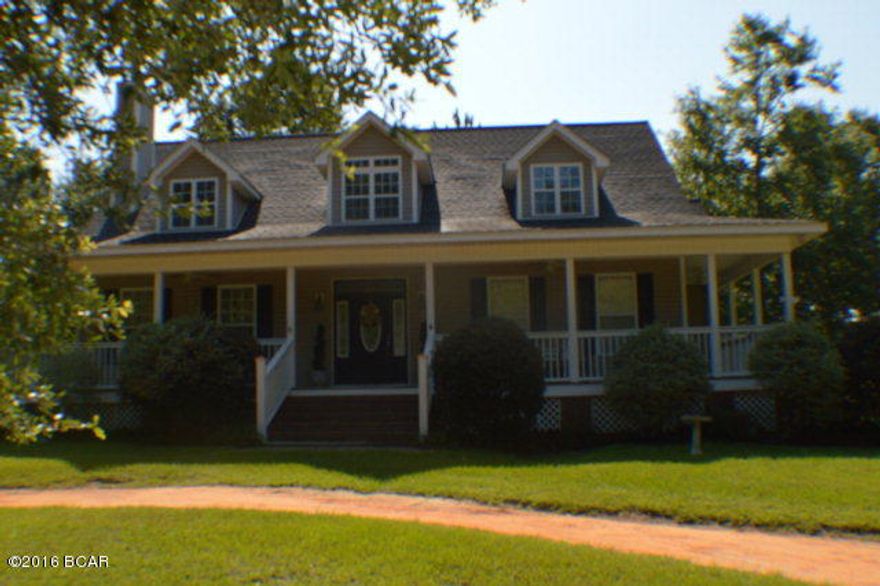 This home sits on 10 acres and gives owners privacy from road. A southern country home with wrap around porch for all those times extra space is needed or to just enjoy a quiet afternoon. The family room has a fireplace and this home features laminate flooring in most of home. Formal dining room has French doors that open to side porch. Eat in kitchen with lots of cabinets. Master bedroom and bath features separate vanities, whirlpool tub and shower. The property has a pole barn and a small pond. Cedar storage building does not convey with home. All this and more. Call to view property today !!!