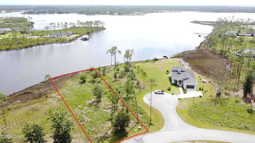 Spectacular Waterfront in the desirable Laird Point. Build your Dream Home on one of the best waterfronts in the area. 75 feet on the water and excellent year round water depths. Will easily accommodate your large cruiser or fishing boat. No worries of low tides or low bridges preventing your short boat ride to the Gulf of Mexico. Only a short dock is needed for great access. Laird Point is located on East Bay which boasts some of the best redfish and speckled trout fishing in the panhandle. This gated waterfront community offers city utilities, underground electric, and ribbon curbed streets. Amenities include tennis courts and RV/Boat storage. Experience water views at nearly every turn in this community. Great proximity to Mexico Beach, Port St Joe and Panama City Beach. Close to shopping and restaurants. Call to schedule a tour of Laird Point.