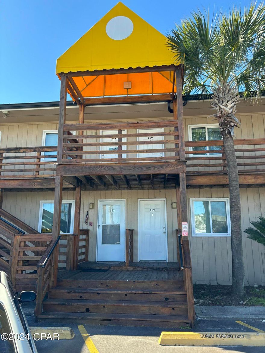 Waterfront Bay view from this 2nd floor Sun Harbor Condominium, Studio, 1 bath with bonus room that could be used at bedroom.  GREAT VIEW. Tastefully updated with special attention paid to kitchen and bathroom. Overlooks the pool. Convenient to Panama City and Panama City Beach, Navy Base, Gulf Coast State College and FSU-PCC. Condo features community pool, on site laundry facility, and is near public transportation. Water, sewer, garbage, basic Cable, pest control, included. This water front condo unit is move-in ready! Features plantation blinds, wood floors, ceiling fans, Comcast Xfinity cable!