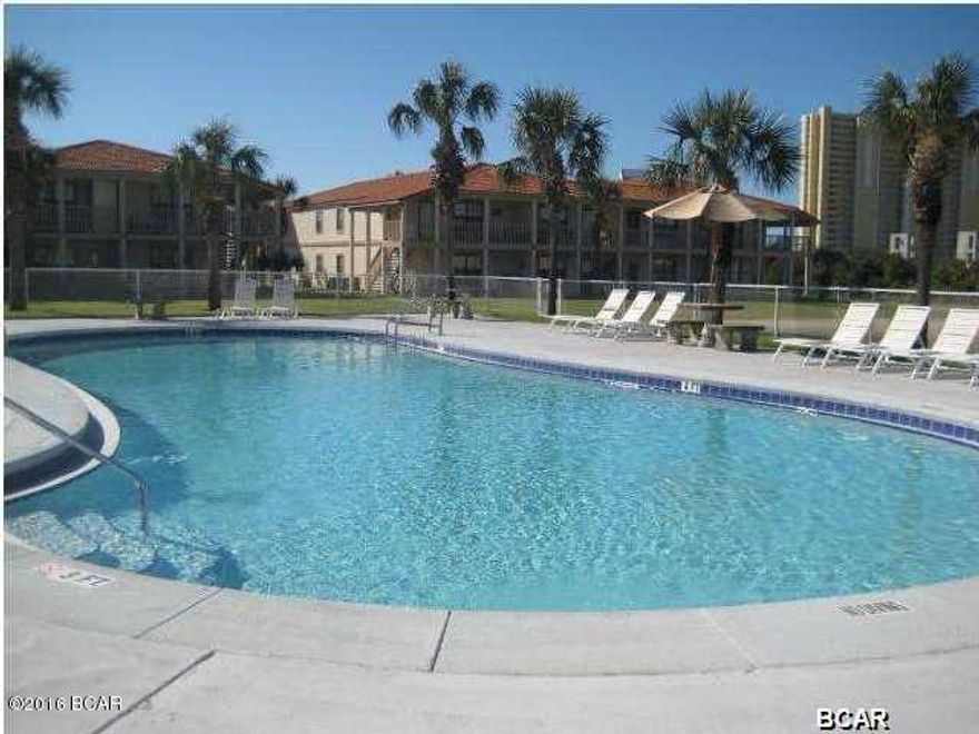 Cute as pie and move in ready!  All ceramic tile flooring, nice paint colors, ceramic kitchen counter tops with mirrored backsplash.  Tropical colored sofa, chairs, bedding & more.  Beautiful cultured marble counter in bath with pretty mirror accessory. Nice large fenced & tiled patio includes concrete bench/umbrella table. Horizon South amenities include the use of four pools, mini golf, shuffle board, tennis, exercise room, hot tub, basketball & more! Cute get-a-way or full time retreat. Apprx. 2 miles from Pier Park.  Great location. Five minute walk to one of the world's most beautiful white sandy beach.