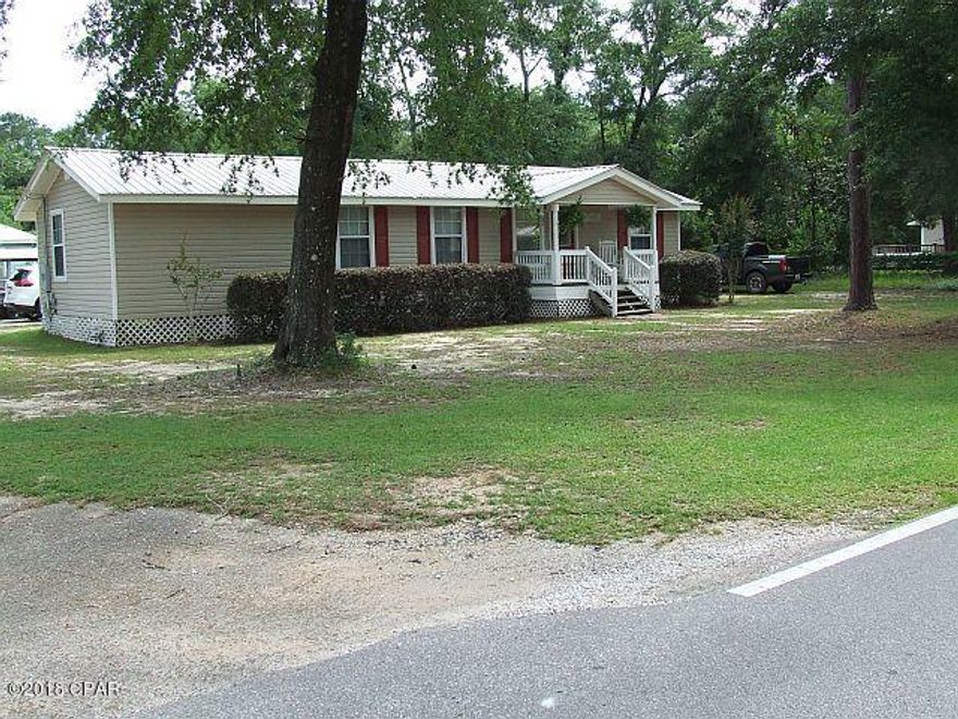 PRICE REDUCED!!! THIS ADORABLE CUSTOM BUILT 3 BEDROOM 2 BATH HOME IS JUST RIGHT FOR THE FIRST TIME BUYERS OR FOR THE EMPTY NESTERS WHO ARE LOOKING TO DOWNSIZE, BUT STILL HAVE PLENTY OF ELBOW ROOM! 1120 SQUARE FEET OF HEATED SPACE (1304 total) USED VERY EFFICIENTLY.LAMINATE FLOORS IN THE LIVING ROOM, DINING AREA, HALLWAY, AND 2 GUEST BEDROOMS.  NEW HARDWOOD FLOORING IN THE MASTER BEDROOM, WITH CERAMIC TILE IN THE MASTER & GUEST BATH. THE KITCHEN HAS STAINLESS STEEL APPLIANCES, PLENTY OF CABINETS & COUNTERSPACE. COVERED FRONT AND BACK PORCHES.  VERY LITTLE UPKEEP AS THE HOME HAS VINYL SIDING, SOFFIT, & FACIA AND A METAL ROOF & YES, THERE IS A SHELTER FOR THAT BOAT AND LAWN MOWER! (THIS IS NOT A MANUFACTURED HOME!) DON'T MISS OUT ON THIS ONE - CALL TODAY!!