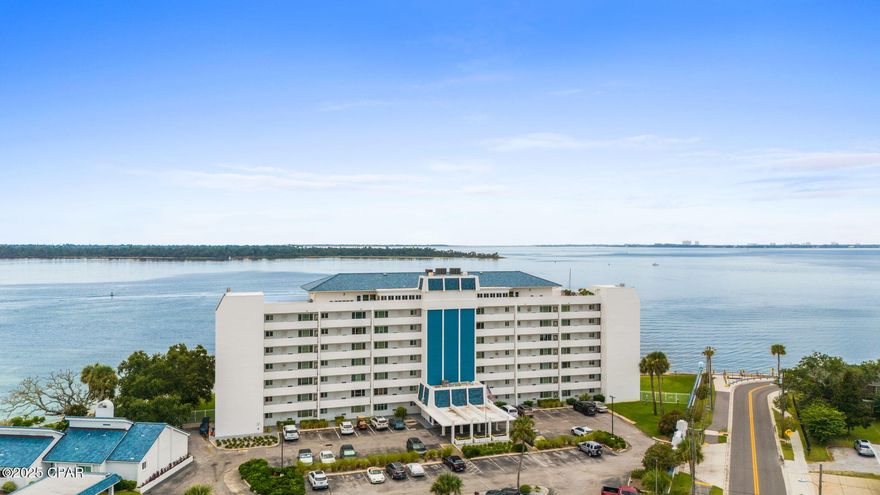 Fixer Upper! 2 bed 2 bath 1,250 sf 2nd floor waterfront condo today!  Cove Condominium is a wonderful residential community right near downtown Panama City.  You will enjoy the beautiful views from your 28' balcony.  Inside there is a spacious living/dining area, kitchen with newer appliances (oven needs to be replaced), the front bedroom has its own ensuite bathroom with walk in shower, and the master has balcony access, ensuite bathroom updated with walk in tub, and walk in closet.  The A/C is newer as is a stackable washer and dryer that come with the unit.  A great upgrade to this unit is fully automated hurricane shutters that can be put down with the touch of a switch.  Items needed to be remodeled in the unit are kitchen cabinets and kitchen countertops, new flooring throughout the living area and bedrooms, some electrical work on outlets and a new stove. The unit comes with a separate 5' x 5' storage area down at the end of the hallway.  Amenities on site include a large pool, covered pavilion, club house with kitchen and bathrooms, and a fishing/boat mooring dock with fish cleaning station. The dock has electric and water running to it. Boats may tie up to the dock for up to 48 hours. There is also a car washing station on site. The lobby is locked and secure for peace of mind. You are just a stone's throw to the downtown marina and boat ramp, wonderful restaurants, Tarpon Dock seafood market, Panama City Center for the Arts, McKenzie Park, concerts on the lawn, Hotel Indigo and all of the downtown boutiques. Make an appointment to see this one today!