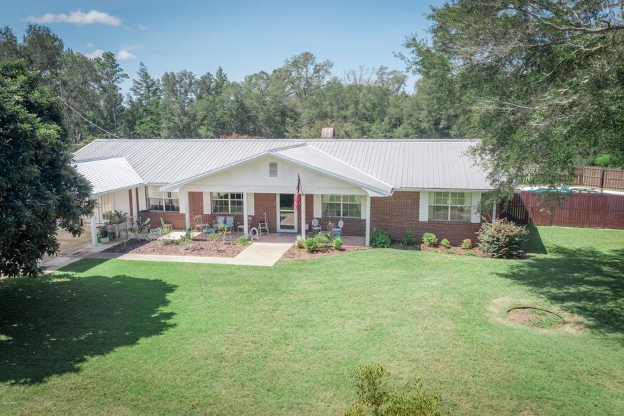 Wow!  This four bedroom rancher has been recently updated.  Travel up the nicely paved drive and see all that this property has to offer.  Located on over three acres this property has a nice attached carport, as well a 18x23 yard building (that features a split A/C unit- could be a great man cave!).  There is also a pole barn.  There is also a backup generator.  Home features a large living room, as well as a nicely appointed kitchen with breakfast bar and Corian countertops.  The home has two masters.  The newest master features nice French doors, and double vanities in the master bath.  This home is a must see!!!