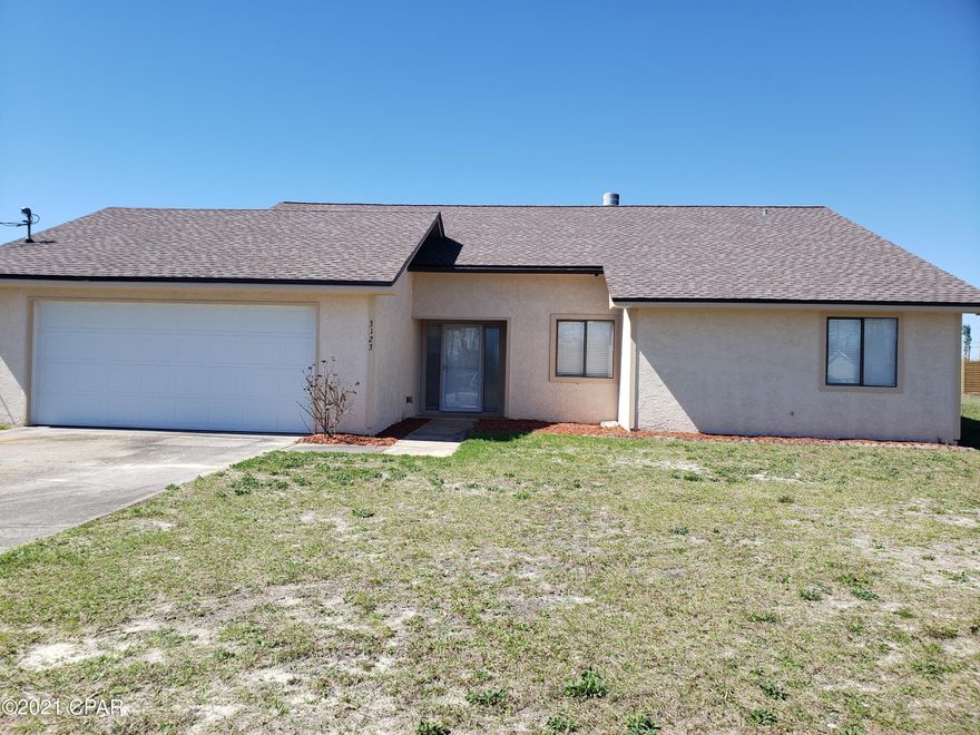 Spacious 3 bed 2 bath home that the interior has been completely redone! Brand new appliances, flooring, paint! Beautiful stone fireplace and Florida room. Large yard is partially fenced. Quiet, rural living and only 10 mintues from shopping, restaurants, schools and Tyndall Air Force Base.