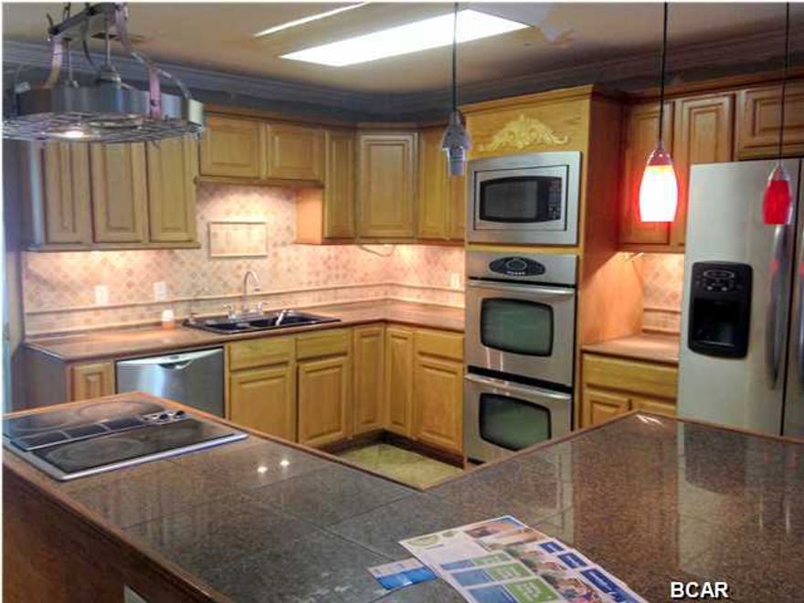 Located in the Cove area, this 3 Bedroom 2 Bath home is ready for your personal touches! Features include formal Living and Dining Rooms, Kitchen equipped w/stainless steel appliances opens up to the Family Room, French doors lead out to the covered porch. Exterior features a wooden deck and a large storage/yard building. Age, Square Footage, and room sizes approx., if important please verify.