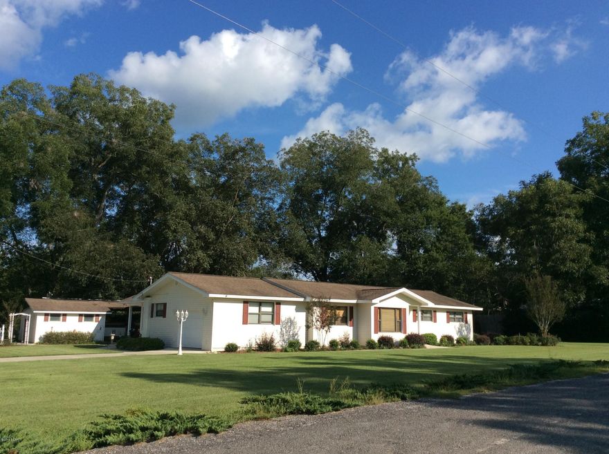 *MOTIVATED SELLER* Absolutely immaculate home just out side of town setting on .64 acres. This 3 bedroom 2 bath home has recently been completely updated. With new kitchen granite counter tops, all new bathrooms and beautiful 16x17 Sunroom. Huge living space with beautiful knotty pine paneled walls. Large dining room and breakfast area off the kitchen. Enjoy the outdoors when cooking in the newly reworked outdoor kitchen and large inviting deck. Home has a big yard with all types of flowering plants and fresh flower beds all around.New sprinkler system and septic system this summer.Complete with a workshop,storage building and carport for your outside toys.Home has an attached one car garage too. You don't want to miss out on this great family home. Call today to have your private showin