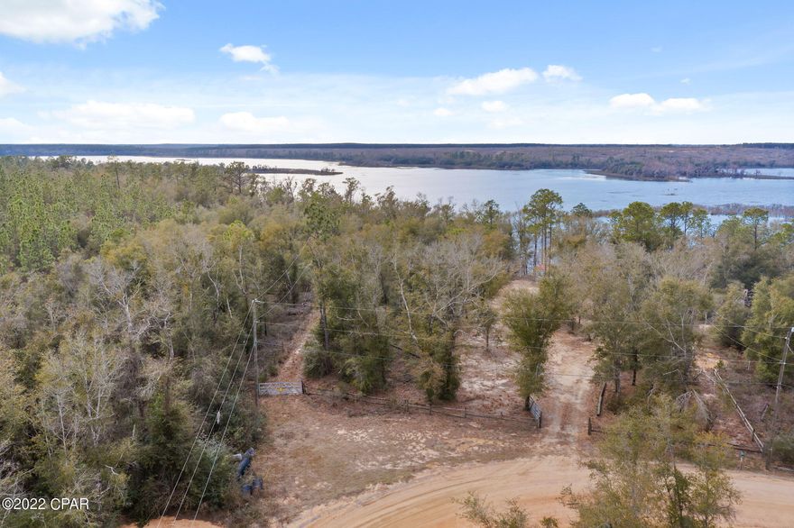 WATERFRONT PROPERTY WAITING FOR YOUR NEW HOME!!!  Porter Lake is the largest lake in Washington County!!!   Rest and relaxation await you in a peaceful country setting. This sportsman's oasis is adjacent to hundreds of acres of Water Management Area which provides for a wide variety of recreational activities!  This wooded lot previously had a mobile home on it.  Call your favorite realtor to schedule your private showing!!!