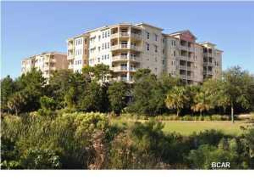 NO HOA FEES FOR 2015! This spacious 2 bedroom plus bonus, 2 bath condo is immaculate and exceptionally decorated. It has been recently completely re-painted, has new upgraded carpet in the bedrooms and bonus room, and beautiful tile throughout the rest of the condo. The bonus room is currently set up as a theater room, but could be used as a bunk room, playroom, large office or even formal dining room. The kitchen features all stainless GE appliances, granite counter tops, rich cabinetry and a large pantry/laundry room. The master suite includes walk-in closet, spacious en-suite bathroom with separate commode room, walk-in shower, large soaking garden tub and separate his/hers vanities. The large balcony has a spectacular view of the resort style pool area and is accessible from both