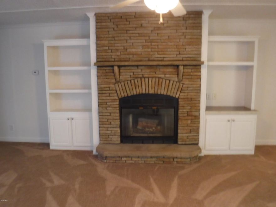 *UPGRADED* Large 3 bedroom 2 bath home with stone, wood burning fireplace and a 3 Acre corner lot on a paved road.  Property has 2 sided access.  Just down the street from Bozeman School.  This is a very wooded and private lot at the end of a long winding driveway.  Storage yard building with carport.  Ample parking on the property.   Interior in EXCELLENT CONDITION.  ALL rooms have large walk-in closets.  Kitchen includes island and pantry upgrades.  This is a MOVE IN READY home waiting for the right buyer.  Space cleared for extra home on back of property.