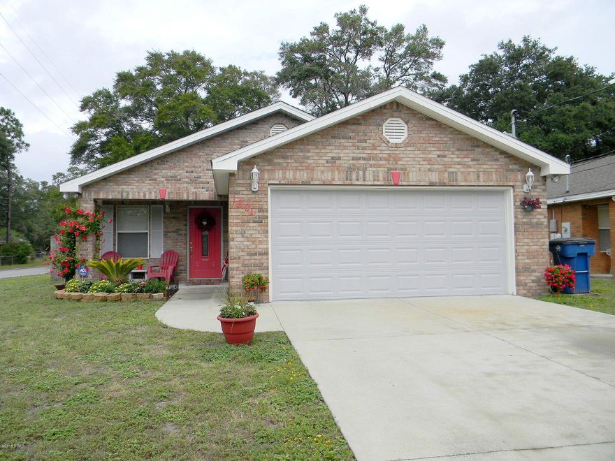 CHARMING ALL BRICK HOME - CHEAPER THAN RENTING! Built in 2007, this well cared for home features 3 bedrooms, 2 bathrooms, an open floor plan, ample natural light, a security system and no carpet. The kitchen boasts stainless steel appliances, lots of counter and cabinet space, attractive counter tops and a huge pantry. The 16x17 living room is a comfortable size and is open to the dining area. The living room, dining area and hallway have new laminate wood flooring. The master bedroom has a 6x5 walk-in closet, a 2nd closet, access to the backyard and an adjoining 10x9 master bathroom. This home also has a 2 car garage. The exterior features a 71x140 corner lot, a privacy fenced backyard, a covered front porch with sitting area and colorful front landscaping. Call today for your own private showing.  Measurements approximate. All info taken from public record and owner; buyer to verify if important.