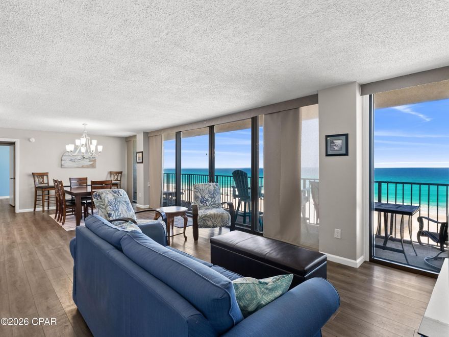 Floor-to-ceiling windows, two gulf-front bedrooms and a low-density beachfront setting create a rare sense of openness in this Seachase condominium. With approximately 1,400 square feet, two bedrooms and two baths, the residence is designed to keep the water in view from nearly every room.

The open living, dining and kitchen areas offer an easy layout for everyday living, vacation stays or rental guests, with new hurricane-rated double sliding glass doors that open directly to the sights and sounds of the shoreline. Wall-spanning windows frame the emerald water beyond, filling the interiors with natural light and giving the main living area an immediate connection to the beach.

Both bedrooms enjoy direct gulf views, a standout feature that adds privacy, symmetry and strong rental appeal. The split-bedroom floor plan creates comfortable separation for owners and guests, while the spacious design allows the condo to live larger than expected.

Seachase is a lower-density gulf-front complex with only 64 residences spread across two buildings, creating a more relaxed coastal experience than larger resort-style properties. Owners and guests enjoy expansive beach frontage, a beachfront pool, pet-friendly ownership and short-term rental flexibility.

The location adds another layer of convenience, with McGuire's Irish Pub within walking distance and Pier Park, Dolly Parton's Pirate Voyage Dinner and Show, Topgolf, Northwest Florida Beaches International Airport and Inlet Beach all within easy reach. With limited opportunities in this beachfront complex, this residence offers compelling potential for personal enjoyment, rental income or both.