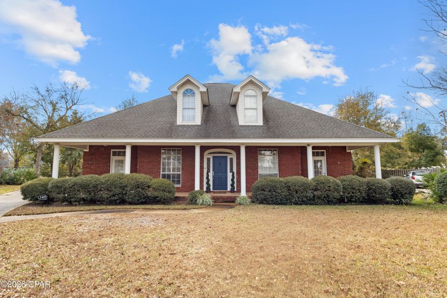 Welcome to 3419 Country Club Court, a meticulously maintained custom brick home showcasing classic brick charm and tucked away on a quiet cul-de-sac in the sought after Panama Country Club community. This 3-bedroom, 2.5-bath residence offers soaring 10 foot ceilings and new flooring throughout, creating a bright, open, and move-in-ready space.

The kitchen features stainless steel appliances, a gas stove, and a cozy breakfast nook, with easy access to both the formal dining room and the main living area. The living room is anchored by a gas fireplace and expansive built-in bookcase, while French doors lead to the screened-in back porch, perfectly blending indoor and outdoor living.

Additional features include, a spacious fenced backyard, a whole house generator, surround sound speakers, an inviting front porch, and a generous 3-car garage providing excellent storage and functionality. Home can be accessed from Country Club Court, Country Club Drive, and Colorado Ave. Offering a seamless blend of quality craftsmanship, comfort, and prime location, this home is a standout in the Panama Country Club.