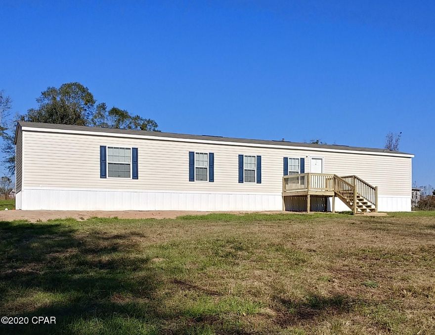 Brand-new 16X80 Scotbilt mobile home on 3 acres with approximately 300 ft of paved frontage on Highway 177. Located in Bethlehem, FL near schools and only 8 miles from Bonifay, FL.  3-bedroom, 2 full bath home that has never been lived in, has just been set up, and is ready to move into. Sits on a nice sloping hill, away from the highway, and overlooking a small pond in the front yard.  Comes with all appliances (Frigidaire) and a Kenmore large-capacity washer and dryer.  New everything. Moisture barrier under home.  This property is unrestricted and perfect for an additional residence, animals, or a great garden. Recent Survey available. Property can be accessed via paved Highway 177 by north survey marker but is easier on the new driveway on Phillips Road. West Florida Electric Coop is electric provider. Seller is a Florida licensed real estate Broker.