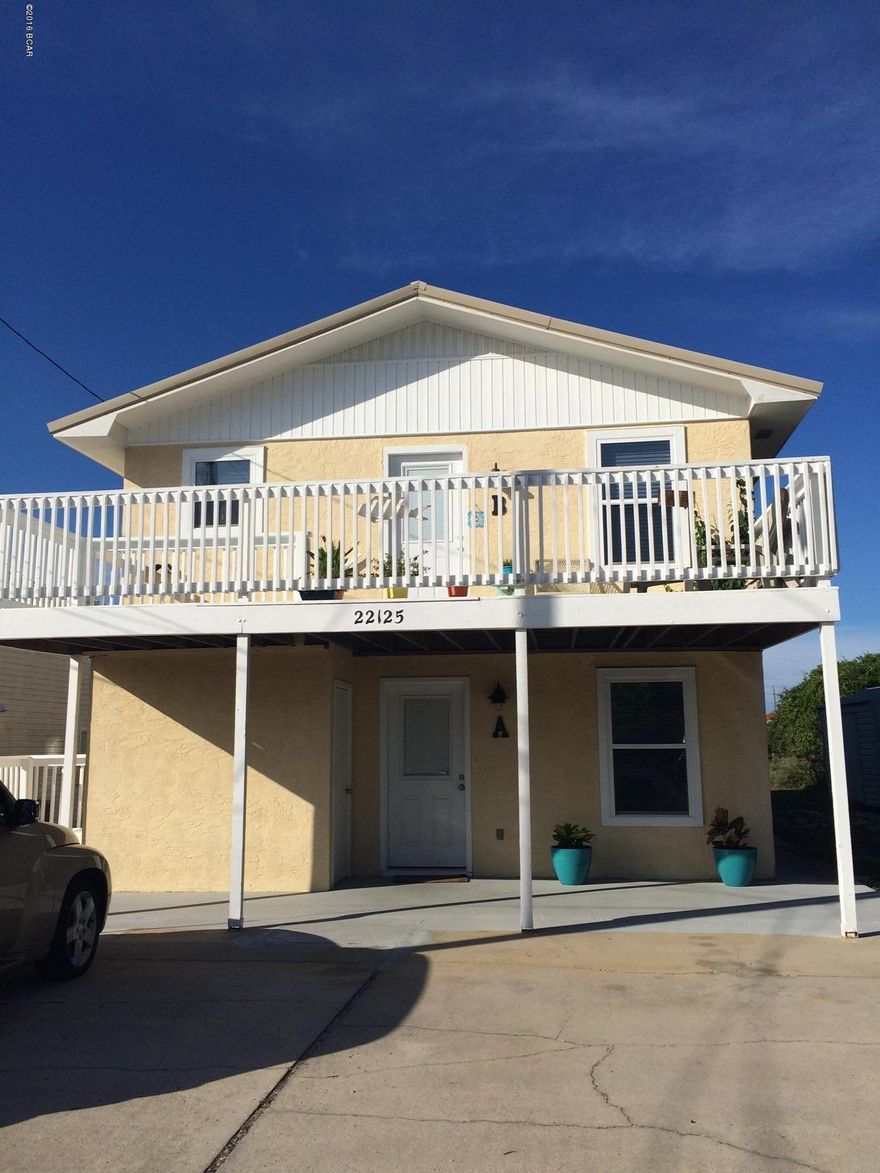 Fantastic 2 bedroom unit located on the West end of Panama City Beach. This is a duplex unit - 1st floor unit with a large master bedroom with french doors leading to the patio and back yard. There is also a nice open porch on the front. Rare find for this type of unit.