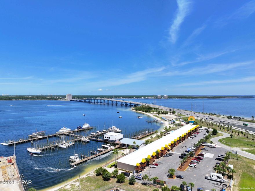 $99,000 PRICE REDUCTION and Short Term Rentals Now Allowed!!! One of the rarest condos ever constructed in Bay County FL. This two story end unit boasts 2 bedrooms (both on first floor), 2 full bathrooms (one on each floor), along with a large kitchen, dining area, and open living room on the second floor! The second floor also features a private covered balcony with Magnificent views of the Bay, Pool, and Marina. The private covered patio of the primary bedroom also features this same view, but with access to it all! The marina offers boat slips for sale and for rent, with and without lifts. New on site restaurant opening soon!!  This condo offers an excellent location and this particular unit is the closest and within walking distance to Gulf Coast State College, Florida State University Panama City, and Carl Gray Park which offers public boat launch ramps, fishing, swimming, picnic areas and grills. This rare two story condo has endless opportunities as a private residence, second home, long term rental or as an investment. This unit is so rare, only one other family has ever owned it since it was originally built. Come see this magnificent condo with so much to offer, amazing views, lots of space, loads of storage, phenomenal location and just so much fun! All info and measurements are approximate and must be confirmed by the buyer if deemed necessary.