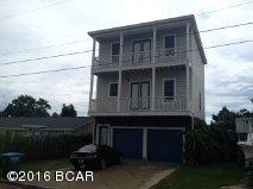 Great beach house located in the Thomas Drive S. Lagoon area, and just a few blocks from the beach, restaurants, fishing, and shopping.  This home features hard wood floors, crown molding, fenced yard with private pool and tiki ''bar'' area.  The 4 bedroom is a separate room with 1/2 bath off of the pool deck with full kitchen.