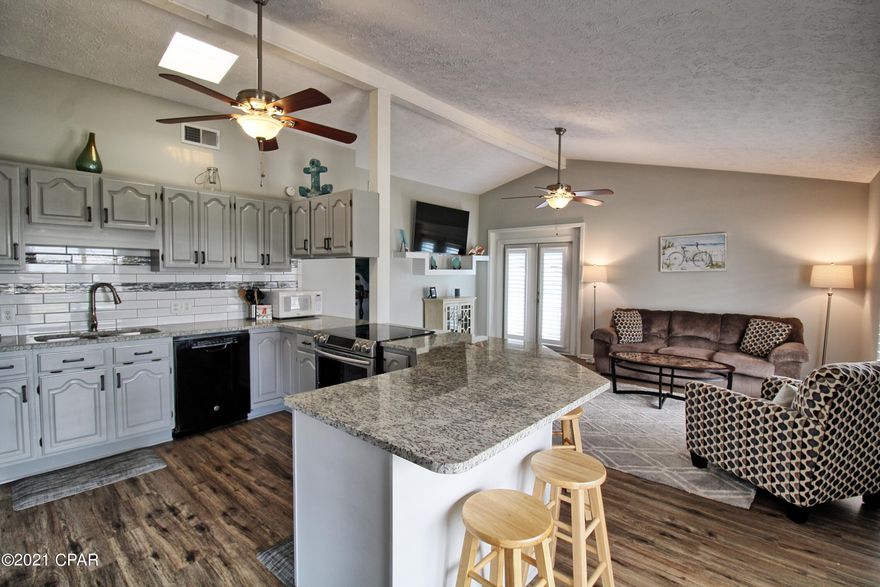 Location, Location Location!  Only a Couple Blocks From The World Famous Emerald Coast Beaches.  Open Sands is Highly Sought After Close Knit Beach Neighborhood and Golf Cart Friendly Community!  

This Adorable 3 Bedroom 2 Bath Home Boasts an Open Floor Plan, Granite Kitchen Counters With Breakfast Bar, Wood Laminate Floors, Guest House, High Ceilings In Common Areas, Meticulously Maintained and Much Much More!