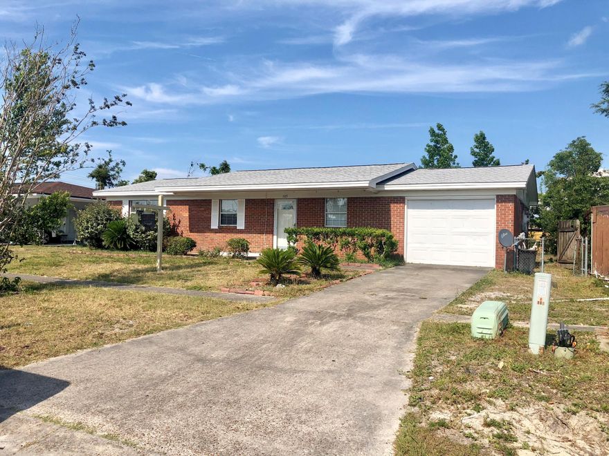 BRICK HOME IN SIDEWALK COMMUNITY!  ***NEW ROOF*** The interior features 3 bedrooms, 2 full bathrooms, 1,100 square feet PLUS a 285 square foot sun room, a semi-open floor plan and a single car garage.  The kitchen has a breakfast bar, white cabinets, stainless steel appliances, and a pantry.  Updates are still being done to this home.  Ask your Realtor for details.  The exterior features a wrap around back deck, a partially fenced yard (chain link), and a covered front porch.  This home is located in a sidewalk community and is close to shopping, schools, and Tyndall AFB.  Call today for a private preview.  Measurements approximate.