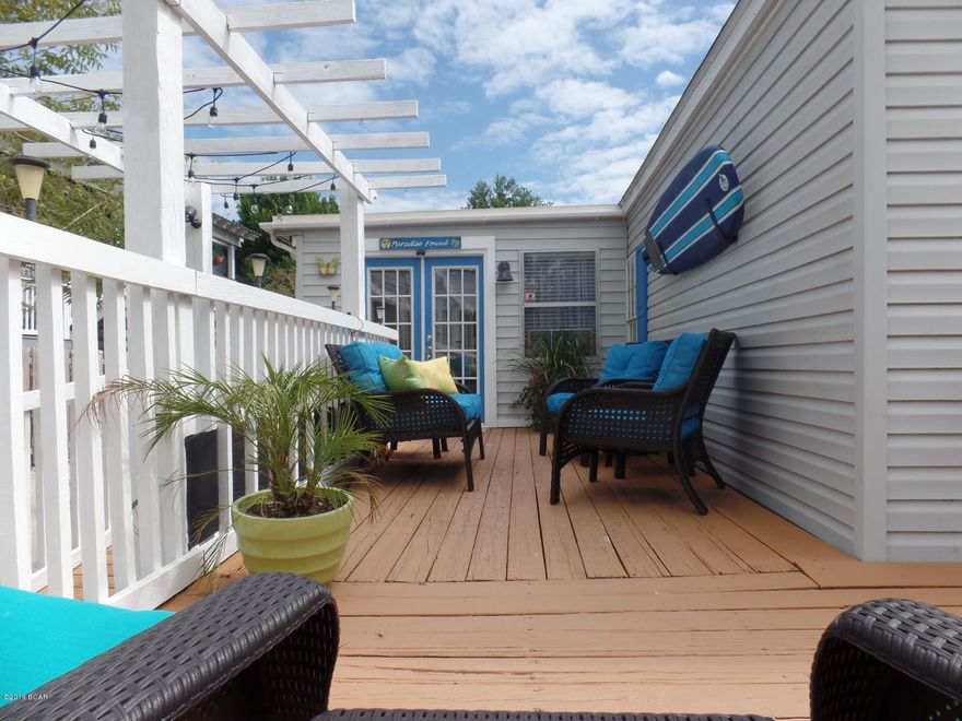 Talk about beachy AND charming! Tastefully decorated and updated, this is a precious piece of Real Estate on the west end that will make any homeowner proud. Owners spent time, money, and effort adding the best touches possible. You can tell someone has great taste here! There is even a screened in porch attached to a well planned storage addition out back. Look for the private outside shower when you walk or ride back from spending time at the beach. Nothing to lose and everything to gain at this great address that is only 2 blocks to the surf and sand! ''A'' rated for ''adorable''! Furnishings are negotiable.