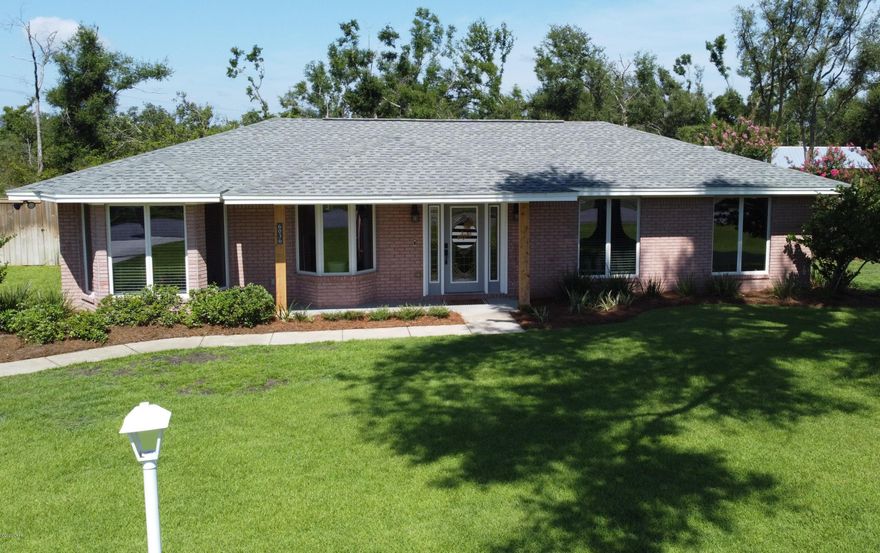 New to the Market! A Stunning All Brick 3/2 on a spacious half acre lot! This entire home has been completely transformed. Enter into an open concept floorplan with plenty of windows and natural light. Beautiful porcelain wood look tile and recessed lighting. Exquisite craftsman carpentry with a shiplap fireplace. The kitchen boasts custom cabinetry, quartz countertops and an amazing island with seating. Beautiful farm sink with apron, new black Stainless Steel appliance package and subway backsplash. Master suite is absolutely perfect featuring a walk in closet and sliding barn style door. Master bath is very spacious with a beautiful subway-tile shower and a freestanding tub with a shiplap wall, the perfect place to relax and unwind. It also has a custom vanity with his and her faucets.. with grainte countertop. Guest rooms are nice sized with one very spacious. Guest bath has custom tile/tub shower with a glass door and a new vanity with granite. LED lighting throughout entire home. Huge backyard offers a screened-in porch and covered patio. A new storage 10x 20 storage building with loft and fenced yard. Also a second 10x 8 storage building for lawn equipment. Even a firepit area with solar lighting, perfect for entertaining. Home is on well and septic so no water bill. Underground utilities in this subdivision and no mobile homes allowed. New roof in 2019. No flood zone and just seconds from a boat launch to access Deerpoint Lake. Home is like new and needs nothing. Do not miss this one!!!