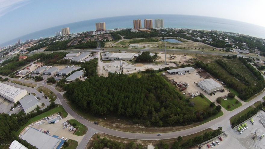 Remarks: EXCELLENT Commercial development opportunity in a PRIME LOCATION!!! Easy access to Destin (20 miles to the West), Northwest Florida Beaches Airport (20 minutes to the NE), and Panama City (20 Minutes to East). Property consists of 4.15 acres located inside the Beach Commerce Park off of Ashley Drive, High and dry with 580+ LF of frontage, Approximately 1200 ft from Hwy 98 with easy tractor trailer access both East and West, zoned Light Industrial. This highly desirable commercial property in the heart of Panama City Beach will not last long!!!  **Listing agent has ownership interest in the property**